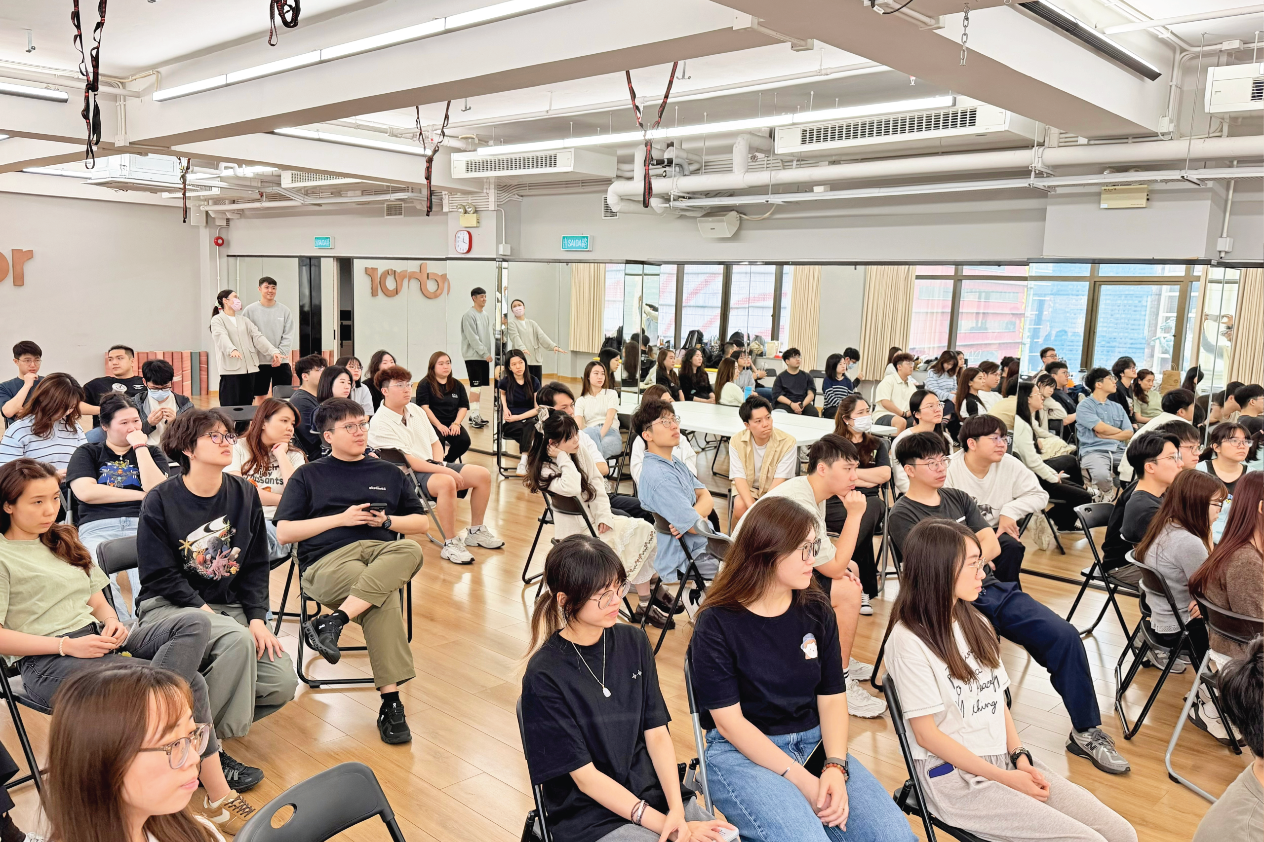 All MathConcept partners and members at the event listening to sharing
